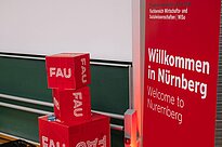 Red Rollup with a Welcome Sign