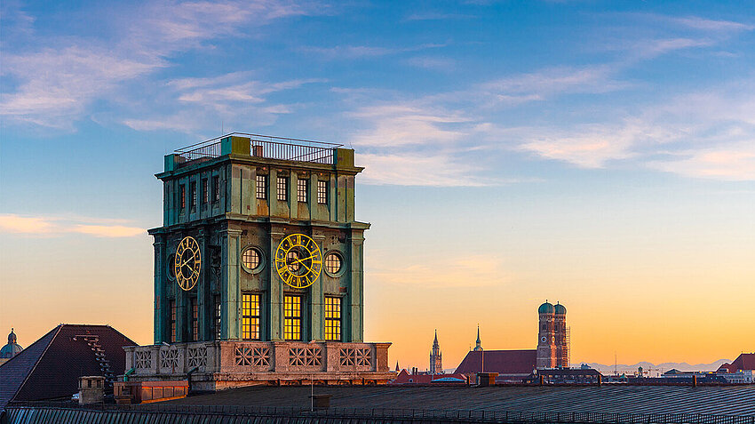 TUM Thiersch tower with the Frauenkirche and Munich skyline in the background