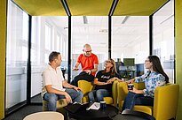 A Group of Students sitting together talking