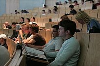 Students attentively engage in a lecture at a lecture hall of Kempten University