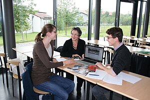 Three Students in the Library
