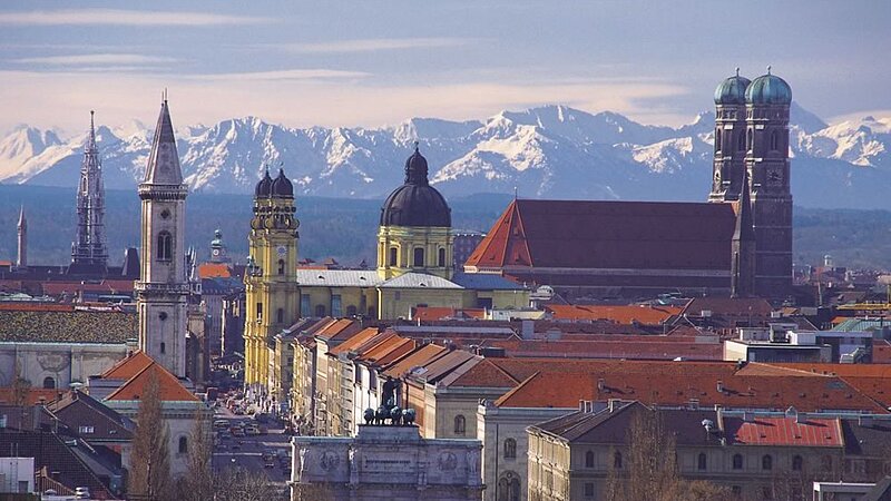 Panoramic view of the city of Munich The city skyline of Munich against the backdrop of the mountains.